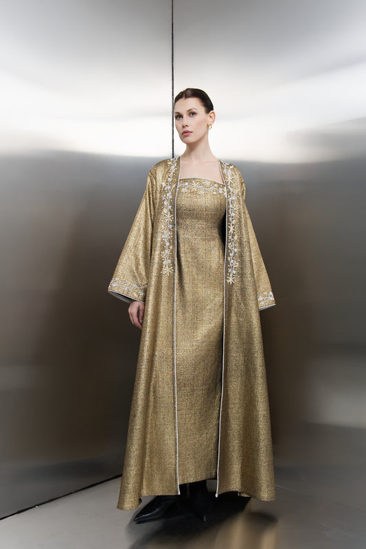 "Mona Al Shebil Kimono Embellished Gold Tweed dress set featuring a structured long jacket with wide sleeves and matching maxi dress in metallic gold weave for luxury Saudi fashion."